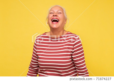 Middle age caucasian woman smiling and laughing hard out loud because funny joke. Middle age caucasian woman smiling and laughing hard out loud because funny joke. 71874227