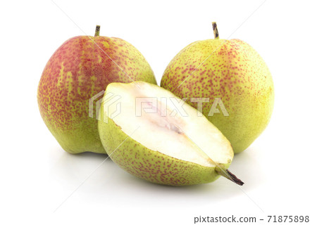 half and whole ripe yellow pear isolated on a white background 71875898