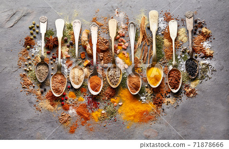 Spices powder in closeup on gray board Spices powder in closeup on gray board 71878666