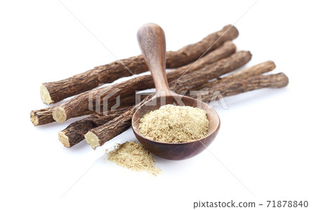 Licorice roots with powder on white Licorice roots with powder on white 71878840