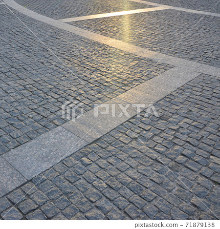 Fragment of the street square, folded out of a gray square paving stone 71879138