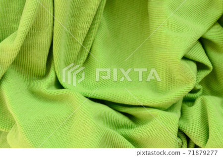 The texture of the fabric is bright green. Material for making shirts and blouses 71879277