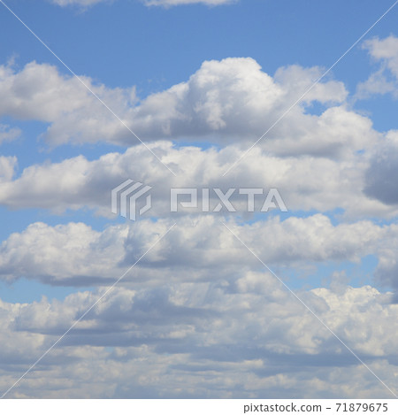 A blue sky with lots of white clouds of different sizes A blue sky with lots of white clouds of different sizes 71879675