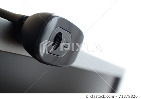 A modern web camera is installed on the body of a flat screen monitor. Device for video communication and recording of high quality video A modern web camera is installed on the body of a flat screen monitor. Device for video communication and recording of high quality video 71879820