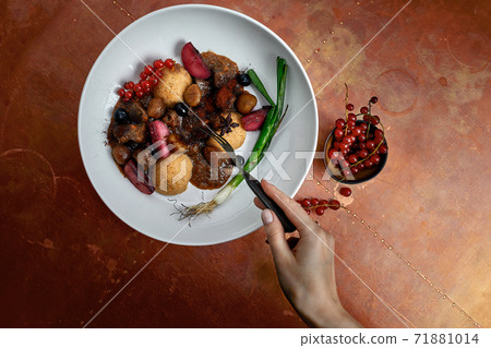 delicious Hummus dish with berries, veggies and sauce in restaurant background. Hummus dish for restaurant 71881014