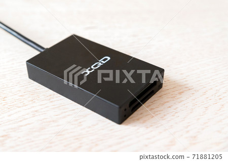 Close up black XQD card readerin whita background Close up black XQD card readerin whita background 71881205