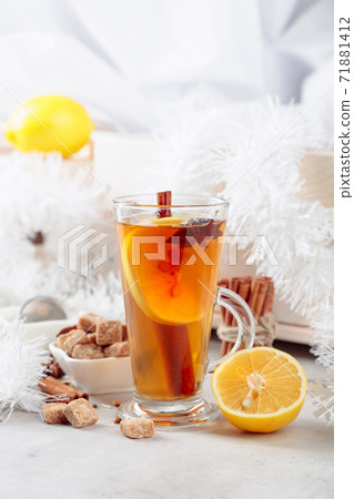 Christmas tea with spices on a white table. 71881412