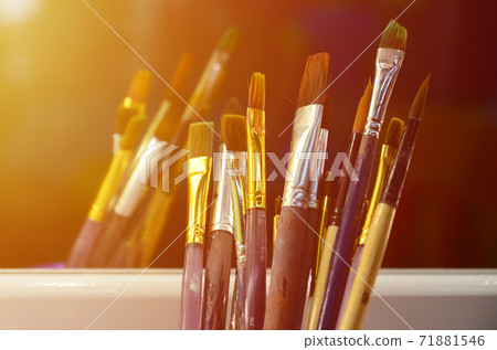 Art paint brushes in cup are located in the children's entertainment hall at the mirror Art paint brushes in cup are located in the children's entertainment hall at the mirror 71881546
