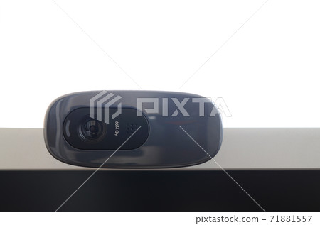 A modern web camera is installed on the body of a flat screen monitor. Device for video communication and recording of high quality video A modern web camera is installed on the body of a flat screen monitor. Device for video communication and recording of high quality video 71881557