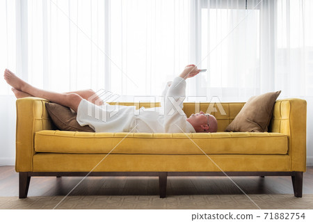 Man is relaxing with mobile phone. Man is relaxing with mobile phone. 71882754