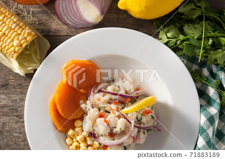 Traditional peruvian ceviche with fish, sweet potato, corn and vegetables 71883189