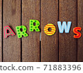 arrows signs on wood background 71883396