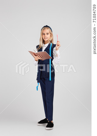 happy little girl holding tape measure 71884789