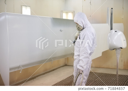 Worker in mask, airplane wing. 71884837