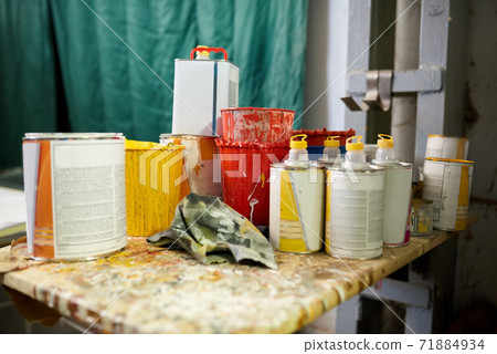 Many cans of paint and thinner. Many cans of paint and thinner. 71884934