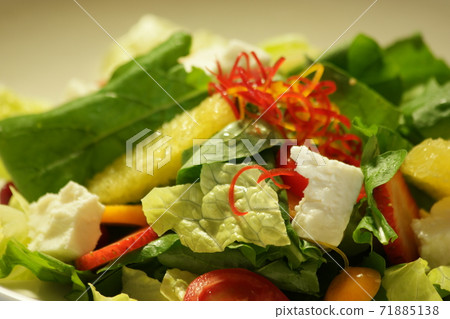 Fruits and vegetable salad close up. Fruits and vegetable salad close up. 71885138