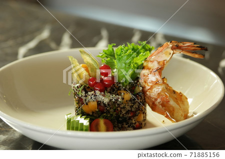 Quinoa salad served with vegetables. 71885156