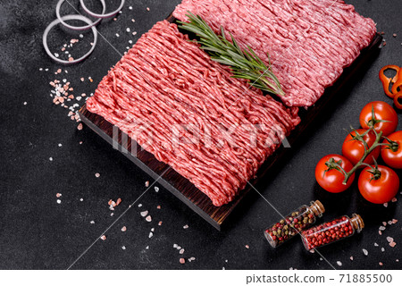 Fresh raw beef mince on a dark background 71885500