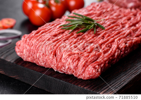 Fresh raw beef mince on a dark background Fresh raw beef mince on a dark background 71885510