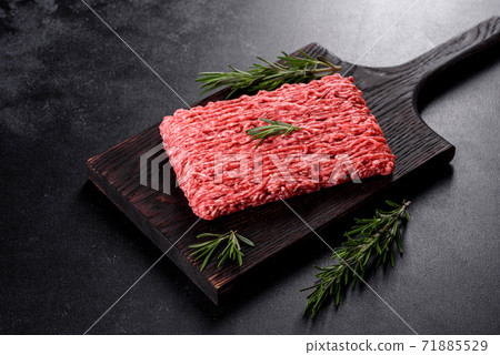 Fresh raw beef mince on a dark background 71885529
