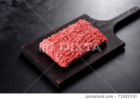 Fresh raw beef mince on a dark background 71885530