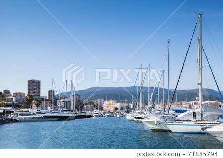 Sailing yachts and motor boats moored in marina 71885793