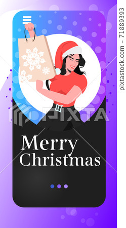 woman in santa hat holding shopping bag new year christmas holidays celebration big sale concept 71889393