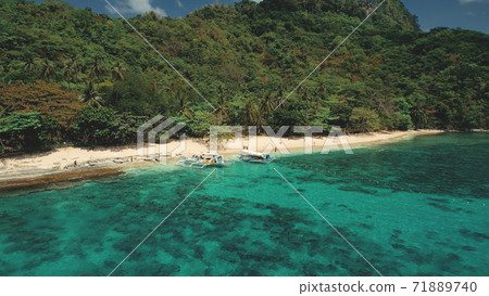 Tropical Philippines Mountain Islands at sea bay aerial view. Green forest on hill ranges at sun day 71889740