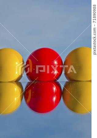 red and yellow billiards balls on mirror red and yellow billiards balls on mirror 71890988