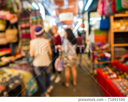Blurred group of tourist people shopping in Blurred group of tourist people shopping in 71891500