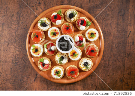 Party food with canapé caviar 71892826