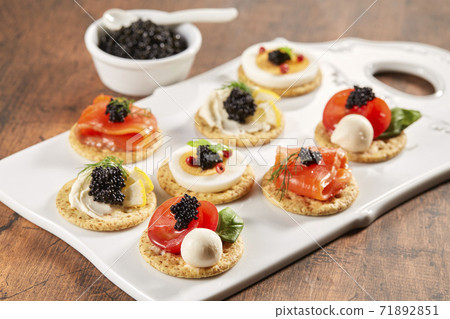 Party food with canapé caviar 71892851