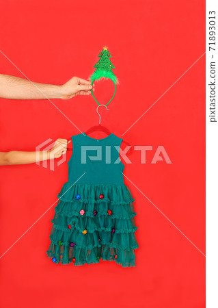 New Year's baby dress on a red background. 71893013