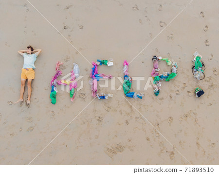 Help lettering made from trash on the beach 71893510