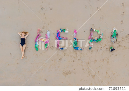 Help lettering made from trash on the beach 71893511