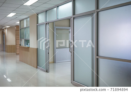 Hospital corridor and open door to ward 71894894