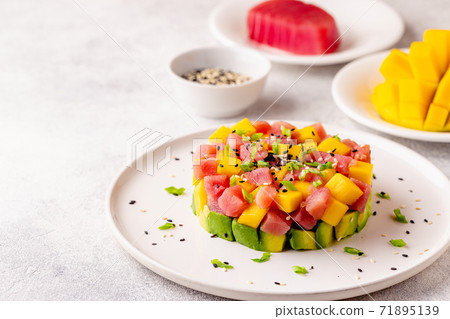 Tuna mango avocado salad tartare. 71895139
