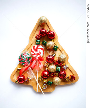 wooden christmas tree with garland and ornaments on white background wooden christmas tree with garland and ornaments on white background 71895697