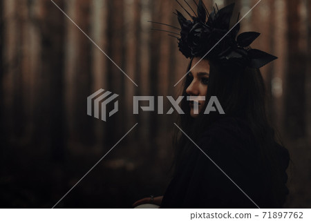 portrait of a beautiful evil witch sorceress in forest portrait of a beautiful evil witch sorceress in forest 71897762