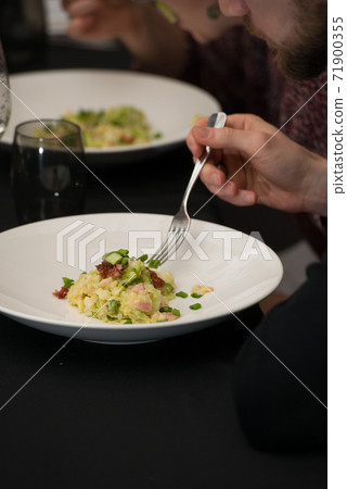 Irish colcannon served in a white bowl or traditional mashed potato with addition of kale, leek and green onion, close-up Irish colcannon served in a white bowl or traditional mashed potato with addition of kale, leek and green onion, close-up 71900355