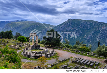 Ruins of Tholos of ancient Greek goddess Athena Pronaia in Delphi, Greece. UNESCO World heritage site. Wide downshot Ruins of Tholos of ancient Greek goddess Athena Pronaia in Delphi, Greece. UNESCO World heritage site. Wide downshot 71901134