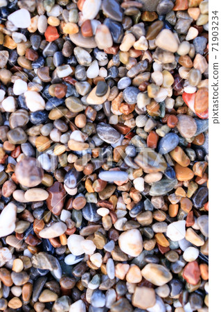 Background of colored sea pebbles on the beach of Alanya, Turkey. Seamless texture Background of colored sea pebbles on the beach of Alanya, Turkey. Seamless texture 71903234