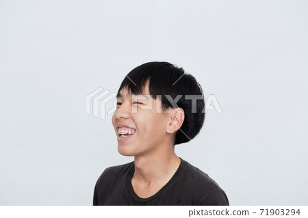 young Asian man making a confident 71903294