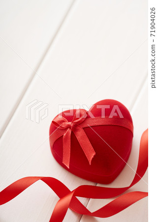 Heart present box on a white table 71904026