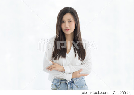 Portrait of beautiful and cute long hair Asian woman standing and looking to camera with a little smile on her face Portrait of beautiful and cute long hair Asian woman standing and looking to camera with a little smile on her face 71905594
