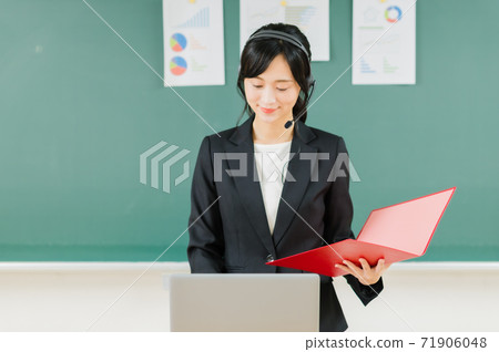Young female teacher giving an online lesson 71906048