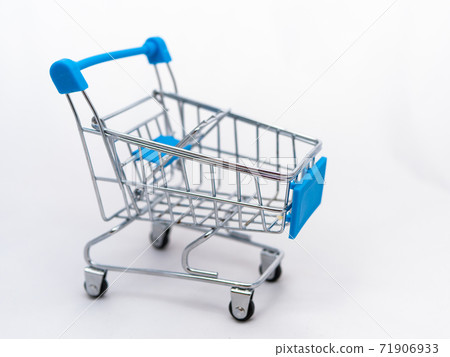 Mini empty grocery cart isolated on white background Mini empty grocery cart isolated on white background 71906933