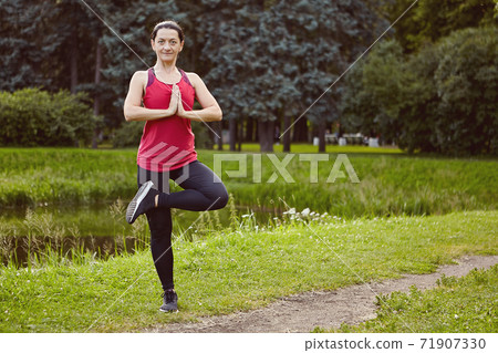 White active woman is exercising outdoor at summer for healthy. 71907330