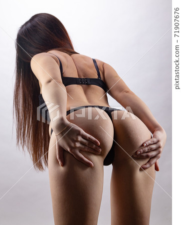 Young sexual girl in black lingerie touching buttocks Young sexual girl in black lingerie touching buttocks 71907676