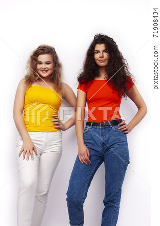 young pretty teenage girls friends with blond and brunette curly hairs posing cheerful isolated on white background, lifestyle people concept young pretty teenage girls friends with blond and brunette curly hairs posing cheerful isolated on white background, lifestyle people concept 71908434